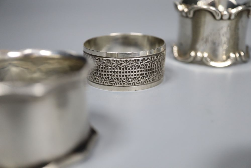 Six assorted silver napkin rings.